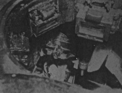 A photo taken through the commanders hatch, showing the breach of the 120 mm.jpg